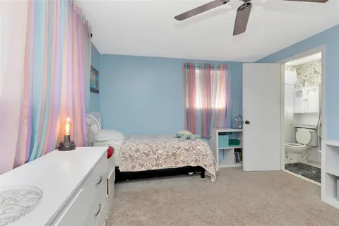 a bedroom with a bed and a table in it