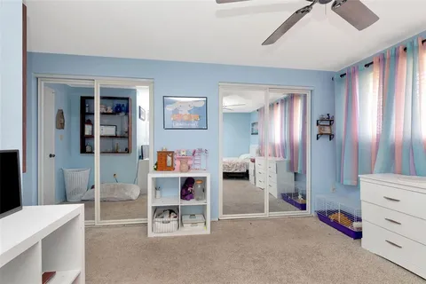 a room with furniture and white walls