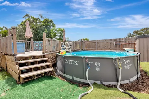 a view of a backyard with a sitting area