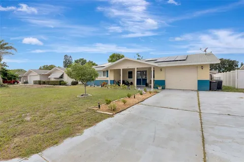 a view of house with yard
