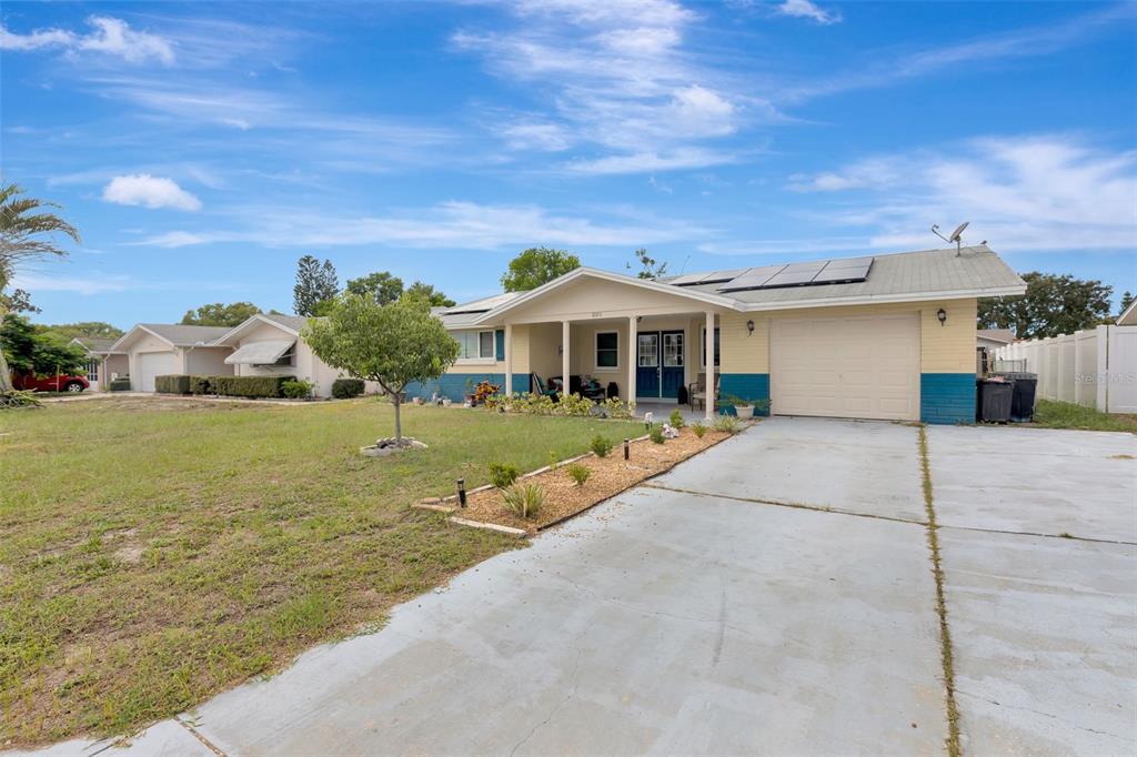 10301 Orchid Drive Port Richey, FL 34668 - Photo 5 of 35 a view of house with yard