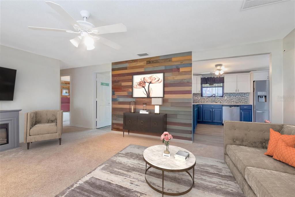 10301 Orchid Drive Port Richey, FL 34668 - Photo 7 of 35 a living room with furniture and a chandelier