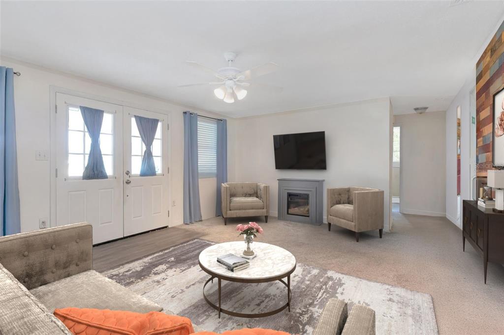 10301 Orchid Drive Port Richey, FL 34668 - Photo 8 of 35 a living room with furniture and a flat screen tv