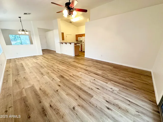 a view of a room with a dishwasher and a white cabinet
