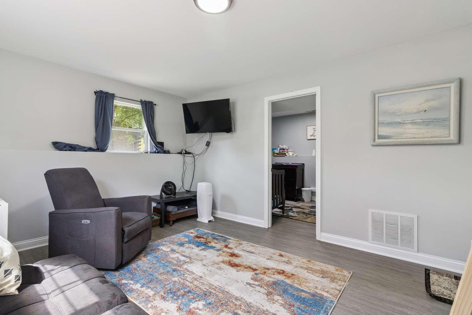 1243 Jericho Road Aurora, IL 60506 - Photo 19 of 25 a living room with furniture and a flat screen tv
