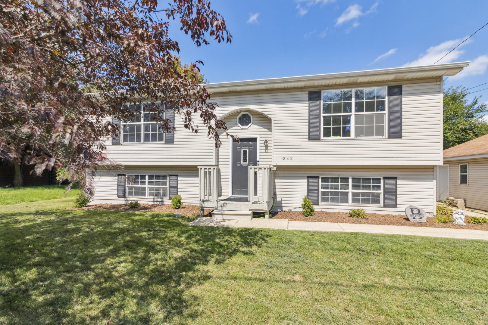 1243 Jericho Road Aurora, IL 60506 - Photo 2 of 25 a front view of a house with a yard
