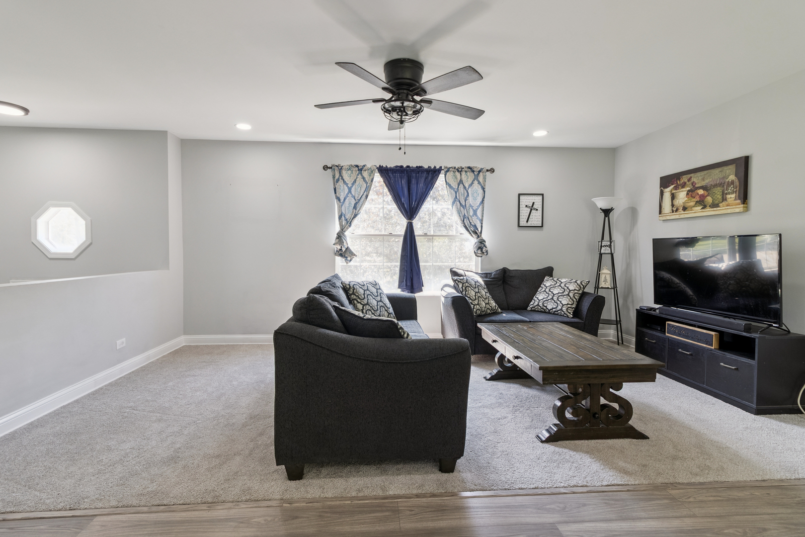 1243 Jericho Road Aurora, IL 60506 - Photo 4 of 25 a living room with furniture and a flat screen tv