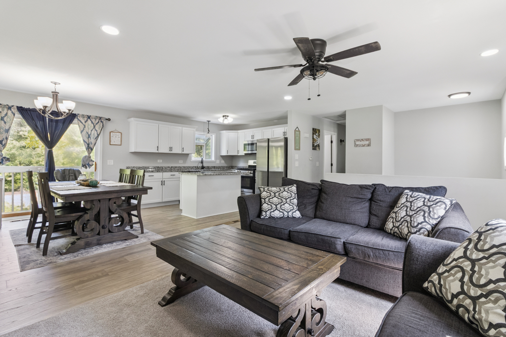 1243 Jericho Road Aurora, IL 60506 - Photo 8 of 25 a living room with furniture kitchen view and a chandelier