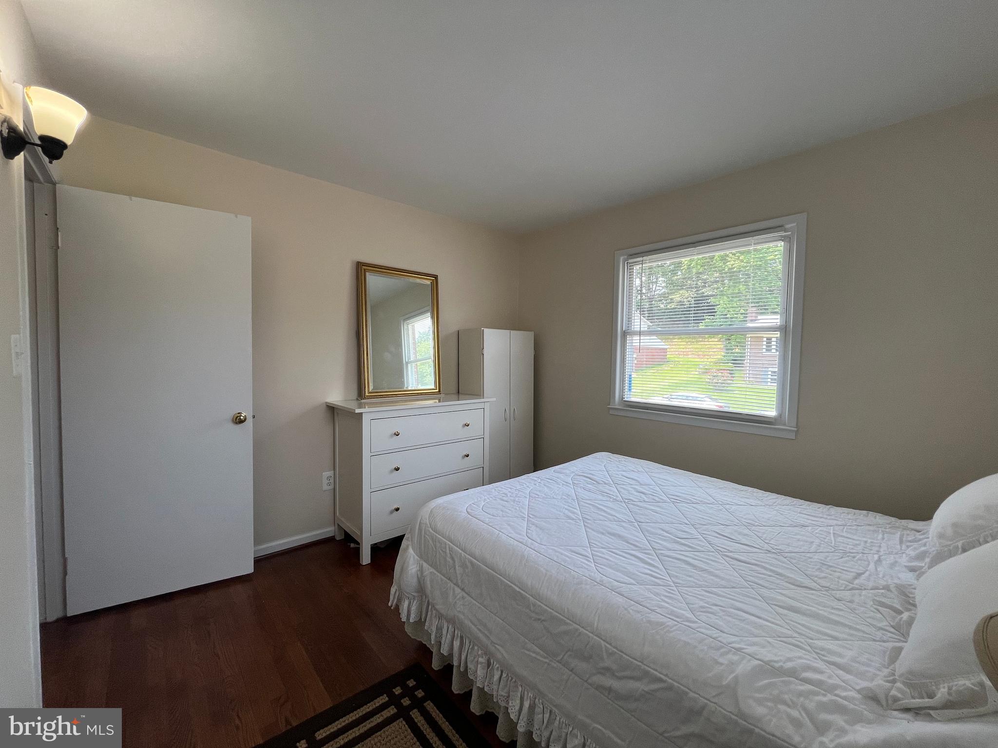 13629 Kingsman Road Woodbridge, VA 22193 - Photo 21 of 43 a bedroom with a bed and a dresser