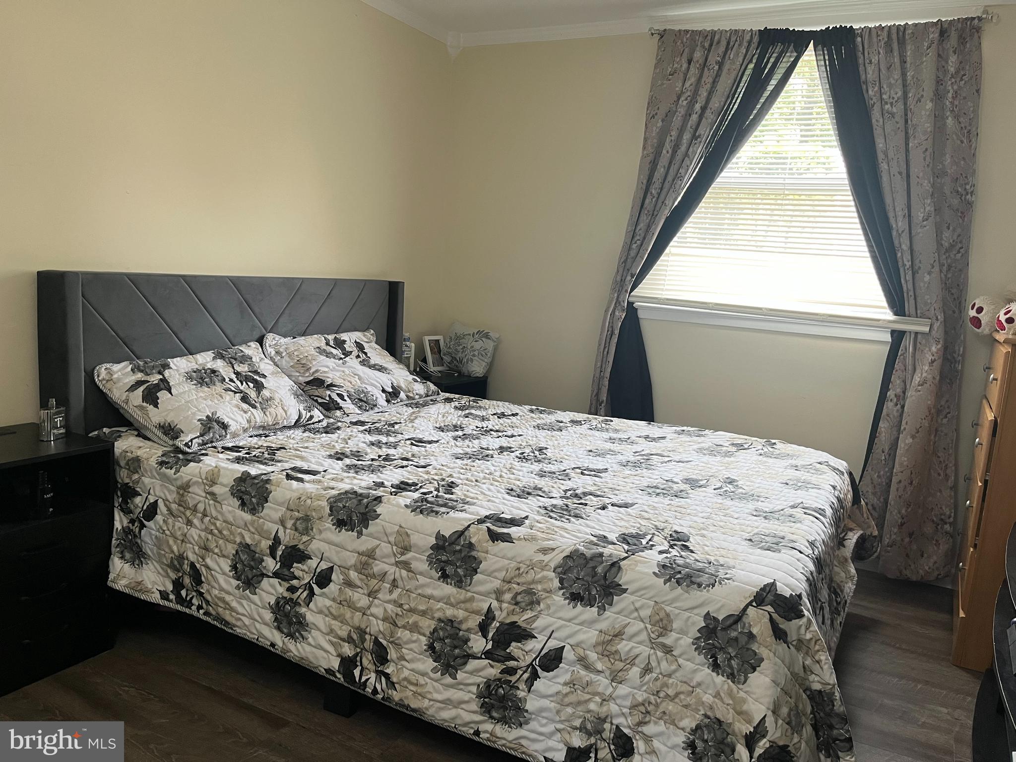 13629 Kingsman Road Woodbridge, VA 22193 - Photo 33 of 43 a bed sitting in a bedroom next to a window
