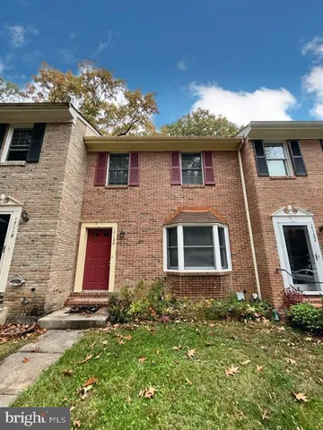 a front view of a house with yard
