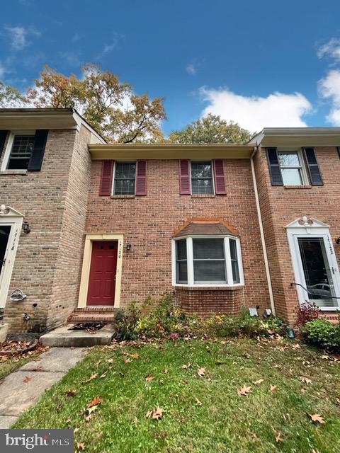 a front view of a house with yard