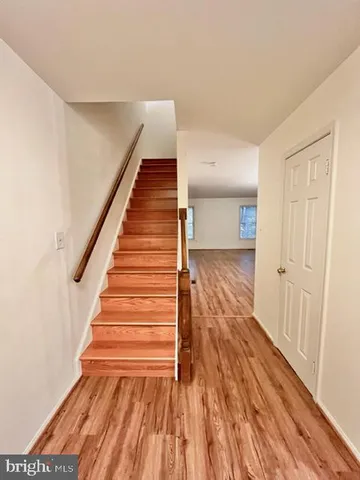 a view of entryway with wooden floor