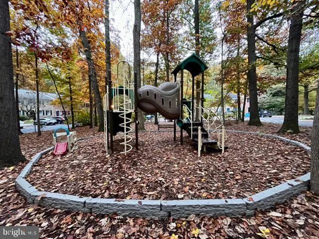 a view of a porch with furniture and a yard