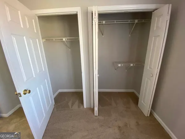 a view of an empty walk in closet