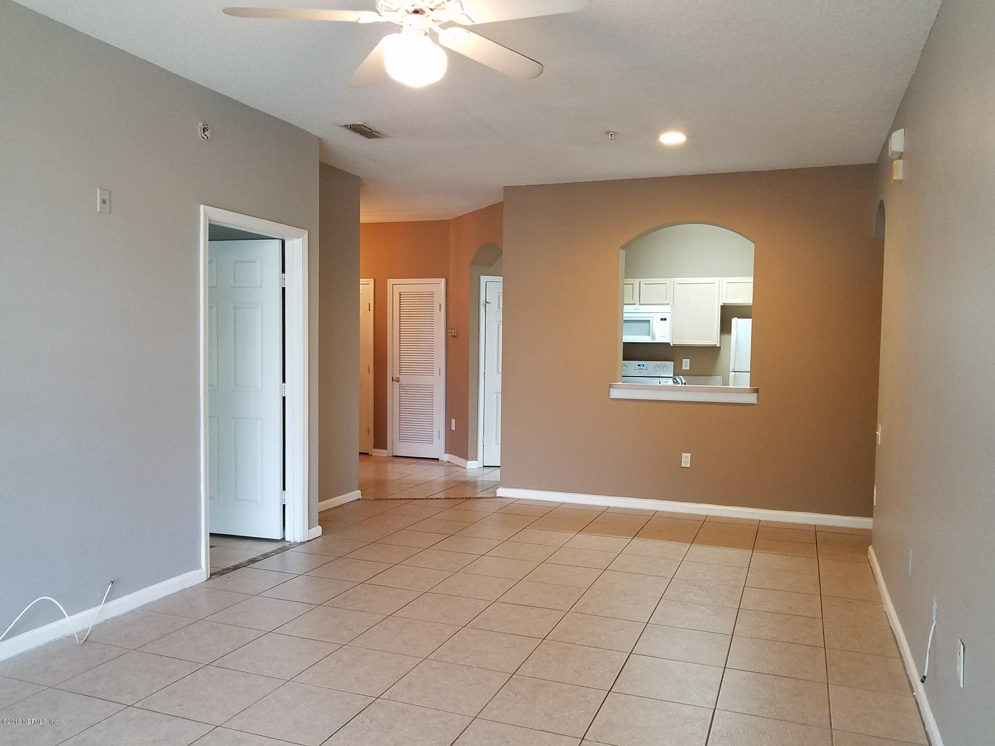 10550 Baymeadows Road, Unit 525 Jacksonville, FL 32256 - Photo 1 of 14 living area and kitchen