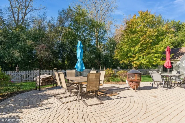 a view of backyard with sitting area