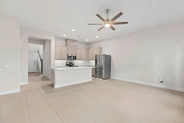 a view of a kitchen with electric appliances