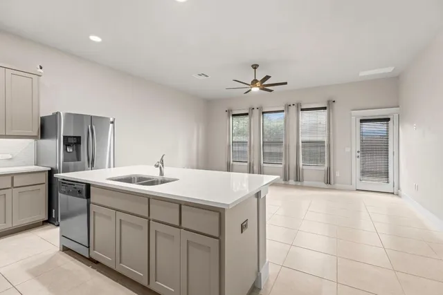 a view of a kitchen with a sink and microwave