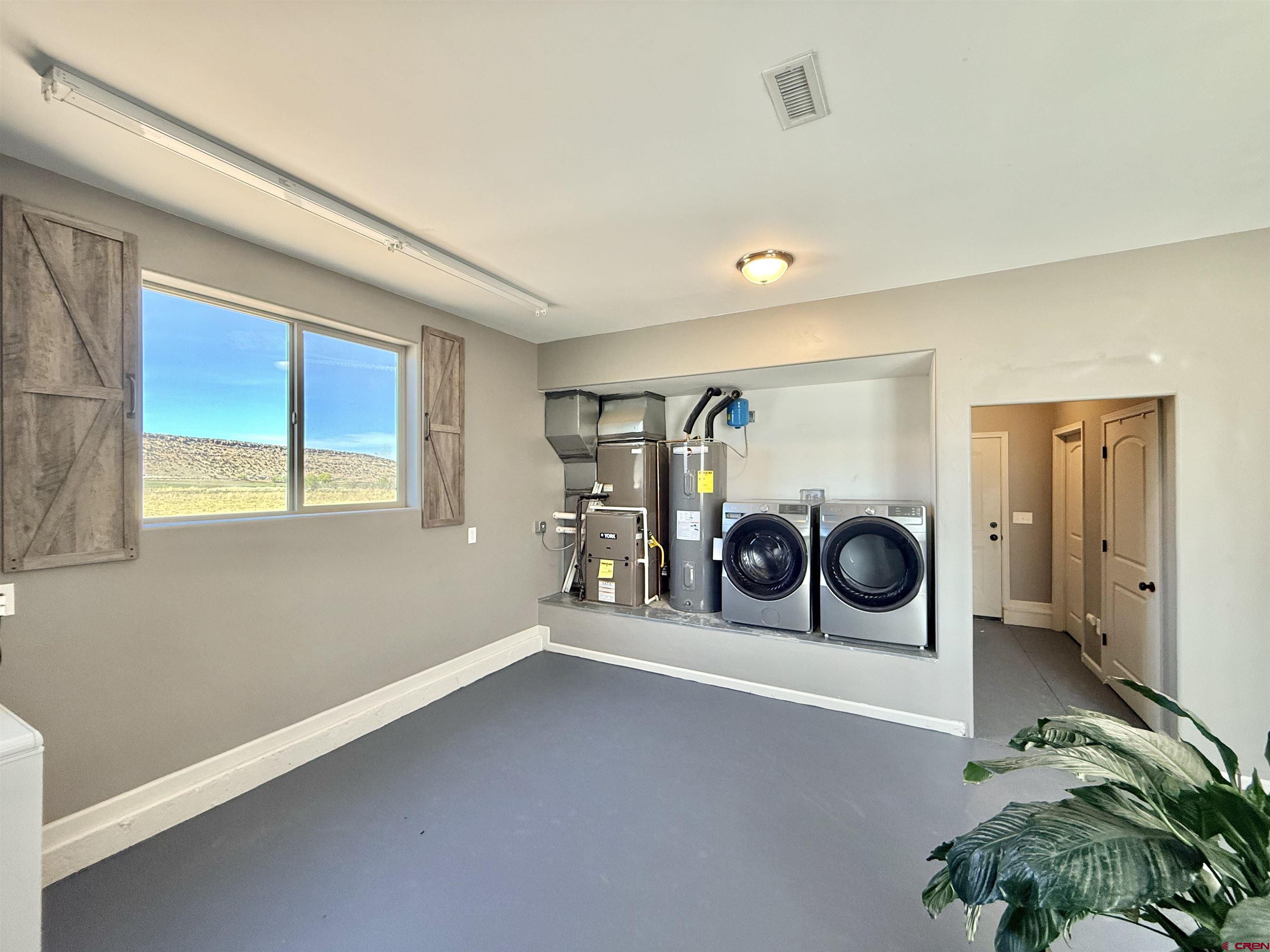 15807 5790th Road Montrose, CO 81403 - Photo 18 of 30 a view of a storage & utility room with a window