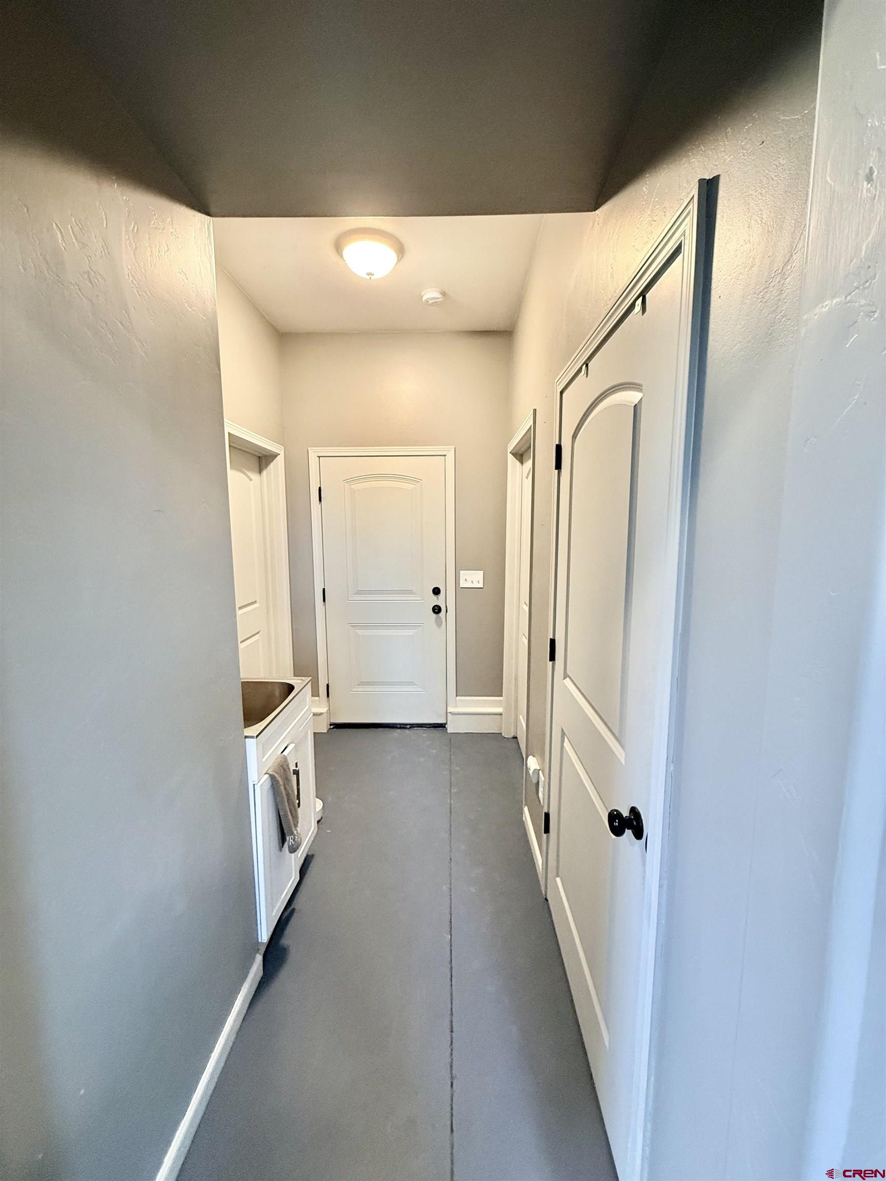 15807 5790th Road Montrose, CO 81403 - Photo 19 of 30 a view of a hallway with wooden floor and a living room