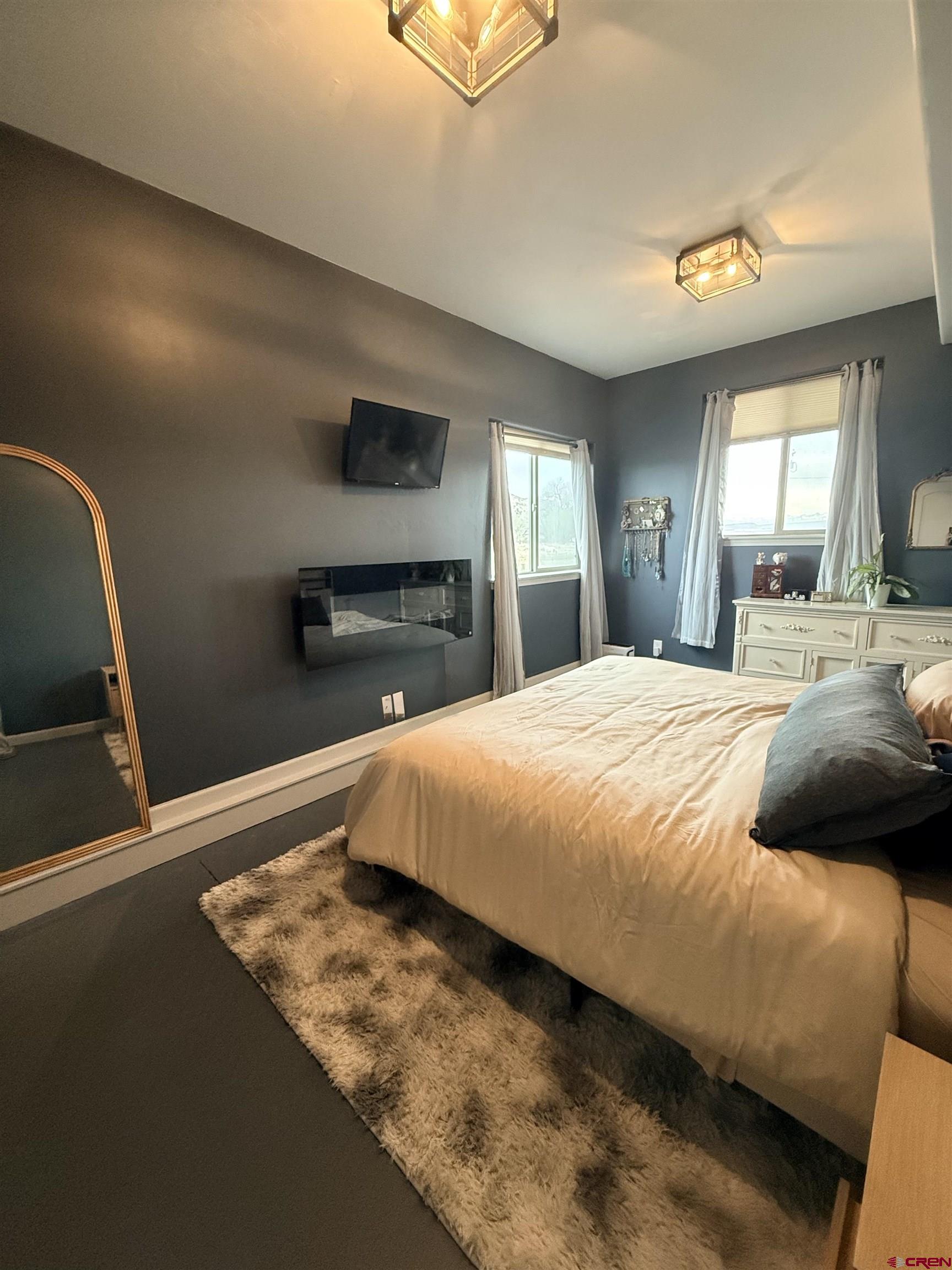15807 5790th Road Montrose, CO 81403 - Photo 21 of 30 a bedroom with a bed and a dresser