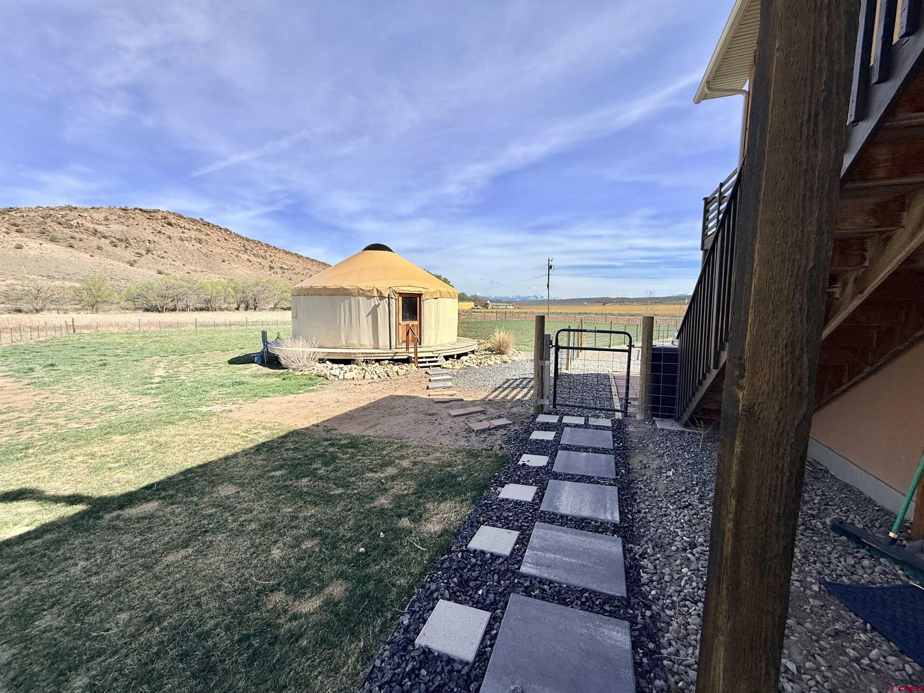 15807 5790th Road Montrose, CO 81403 - Photo 24 of 30 a view of a house with a yard