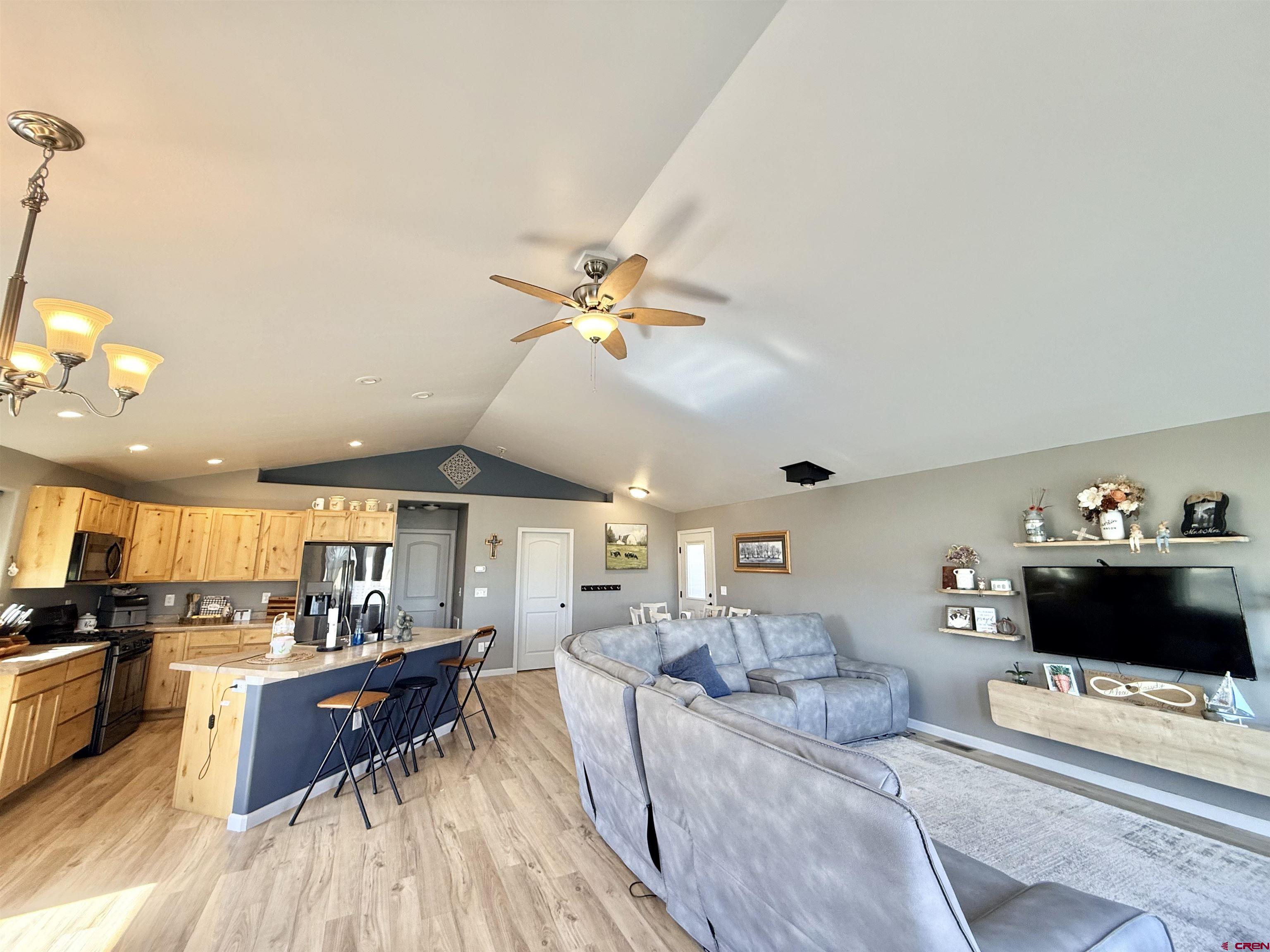 15807 5790th Road Montrose, CO 81403 - Photo 6 of 30 a living room with furniture and a flat screen tv