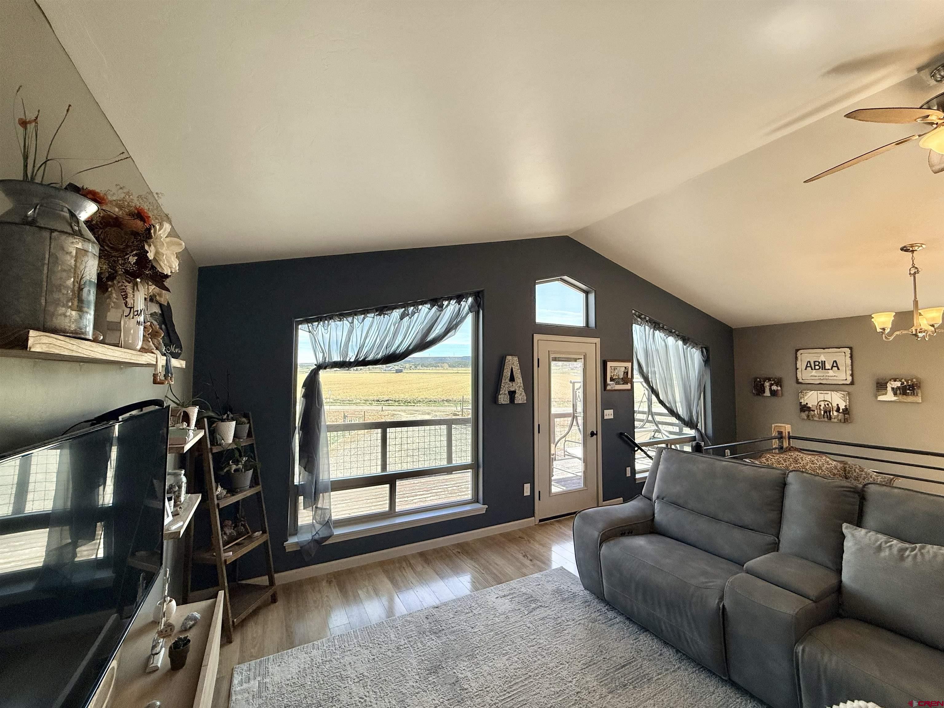 15807 5790th Road Montrose, CO 81403 - Photo 7 of 30 a living room with furniture and a flat screen tv