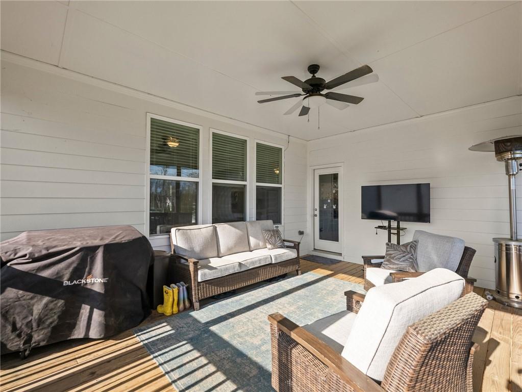 857 Champagne Lane Hoschton, GA 30548 - Photo 37 of 73 a living room with furniture and a flat screen tv
