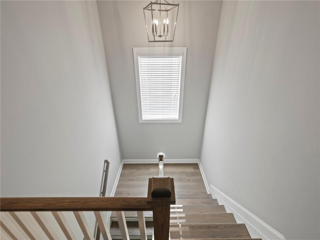 857 Champagne Lane Hoschton, GA 30548 - Photo 43 of 73 a view of a hallway with windows