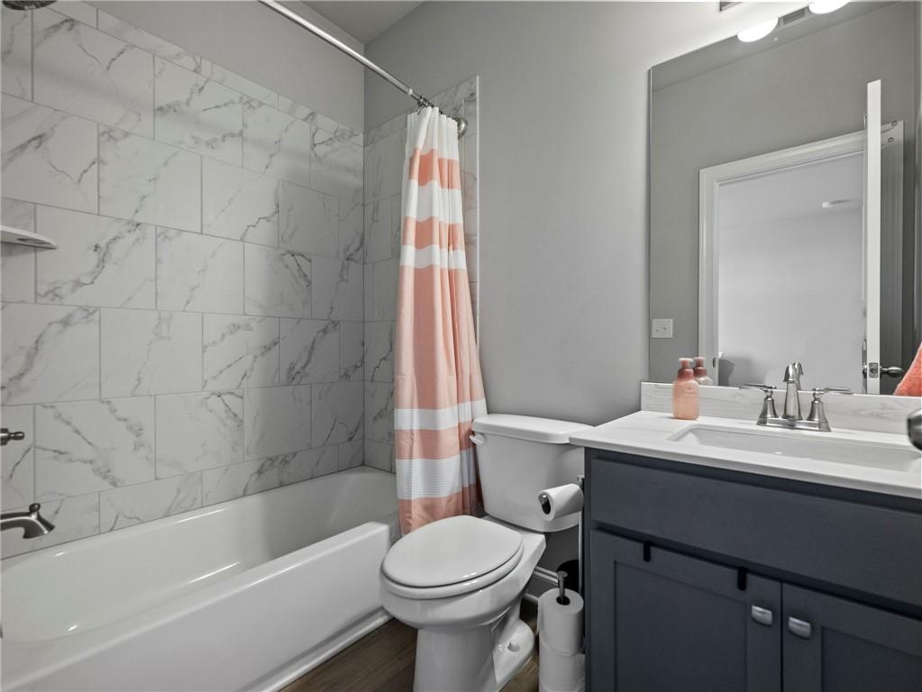 857 Champagne Lane Hoschton, GA 30548 - Photo 48 of 73 a bathroom with a sink toilet and shower