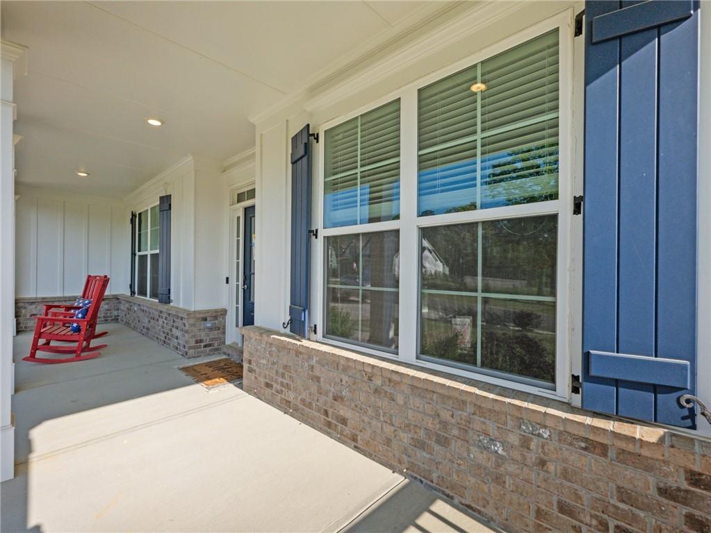 857 Champagne Lane Hoschton, GA 30548 - Photo 61 of 73 a bedroom with a bed and a large window