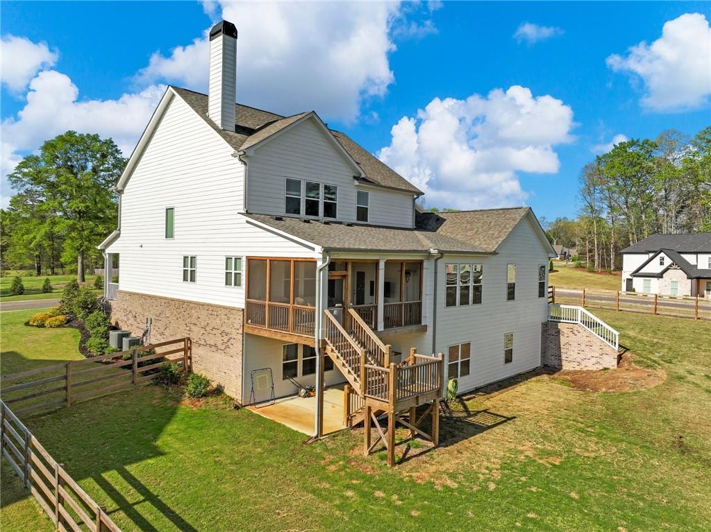 857 Champagne Lane Hoschton, GA 30548 - Photo 69 of 73 a view of a house with a yard