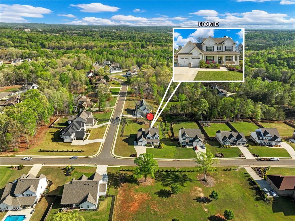 857 Champagne Lane Hoschton, GA 30548 - Photo 73 of 73 view of an aerial view of residential houses with outdoor space and swimming pool