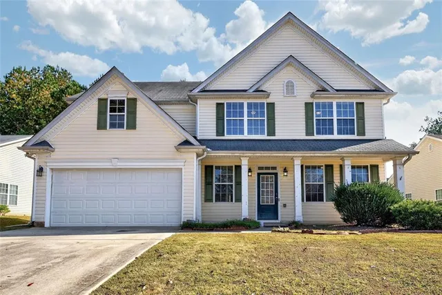 front view of a house and a yard