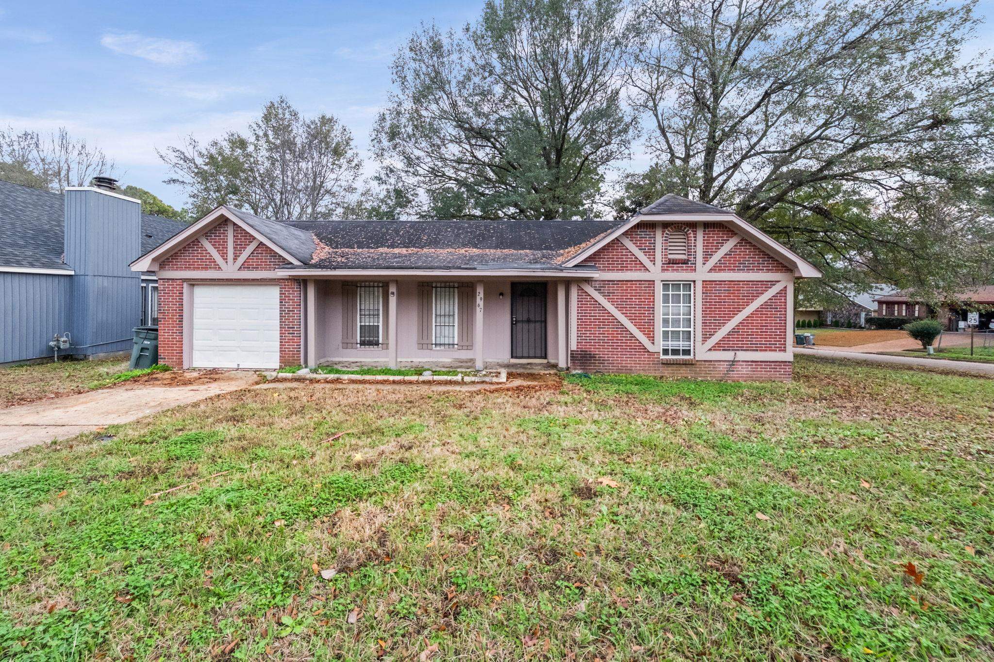 a front view of a house with garden