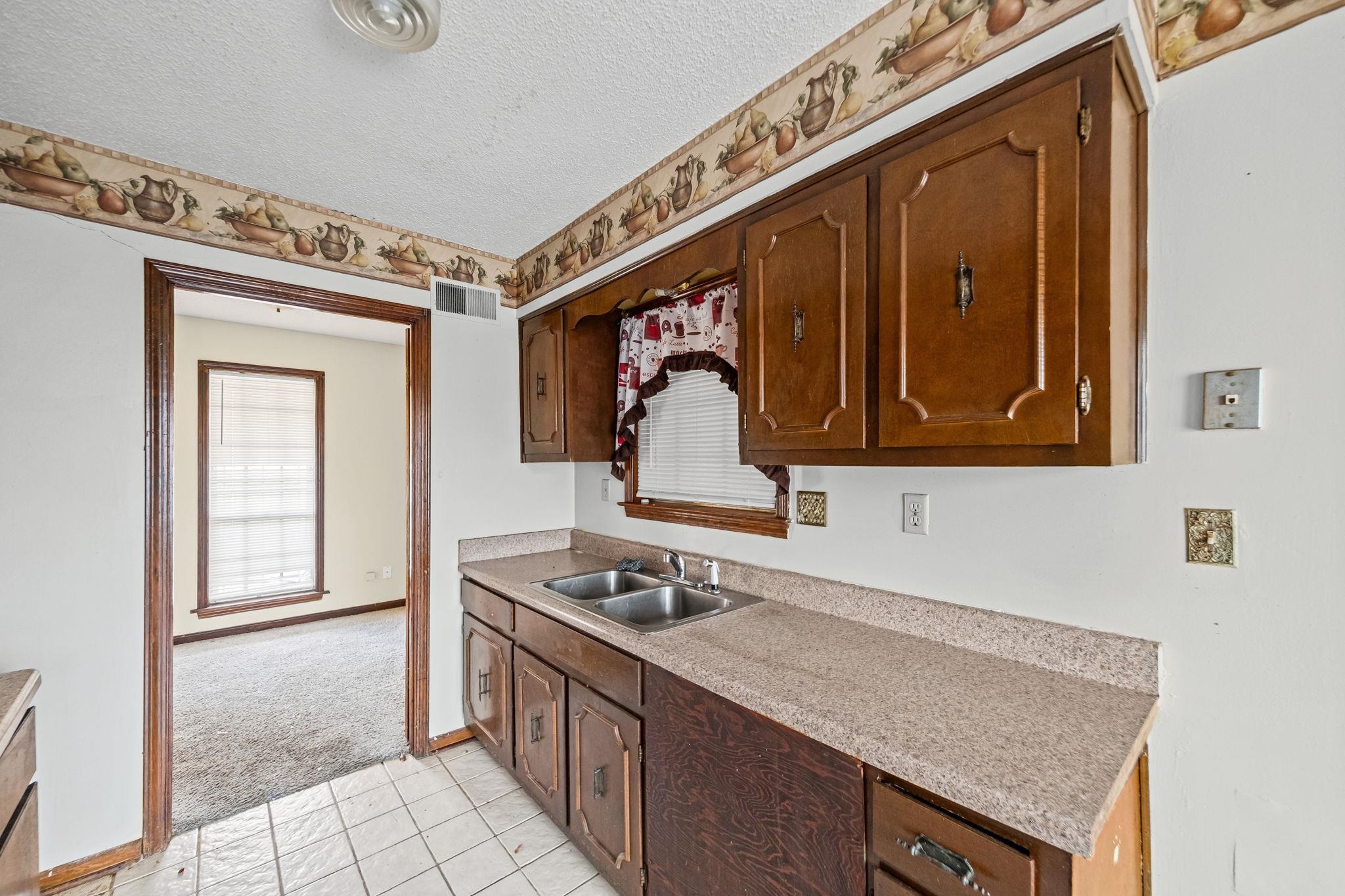 2967 Meadowfair Road Memphis, TN 38118 - Photo 11 of 19 a utility room with sink dryer and washer