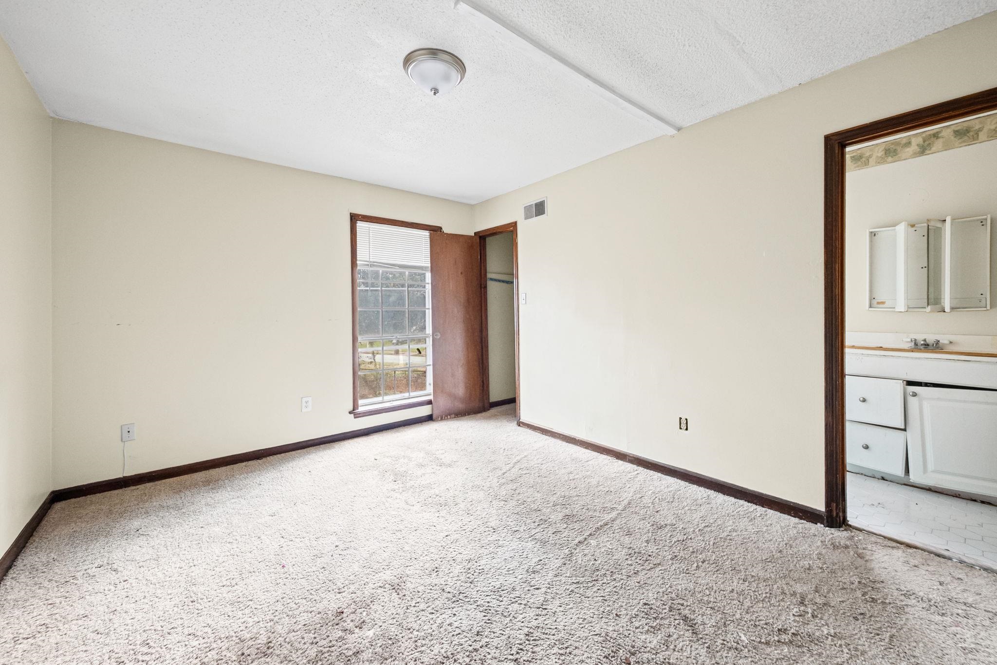 2967 Meadowfair Road Memphis, TN 38118 - Photo 14 of 19 a view of an empty room with a window