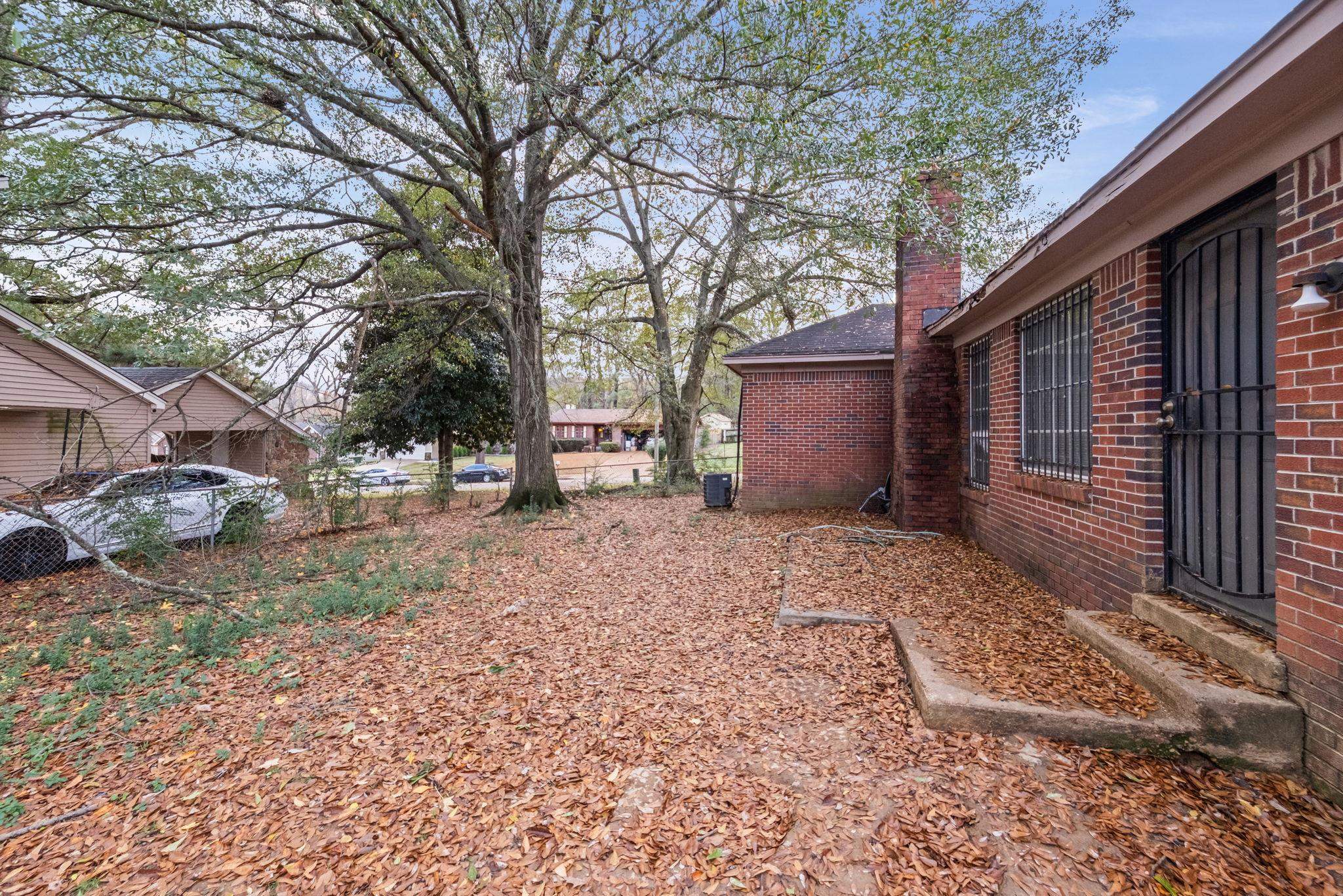 2967 Meadowfair Road Memphis, TN 38118 - Photo 18 of 19 a front view of a house with a yard and garage