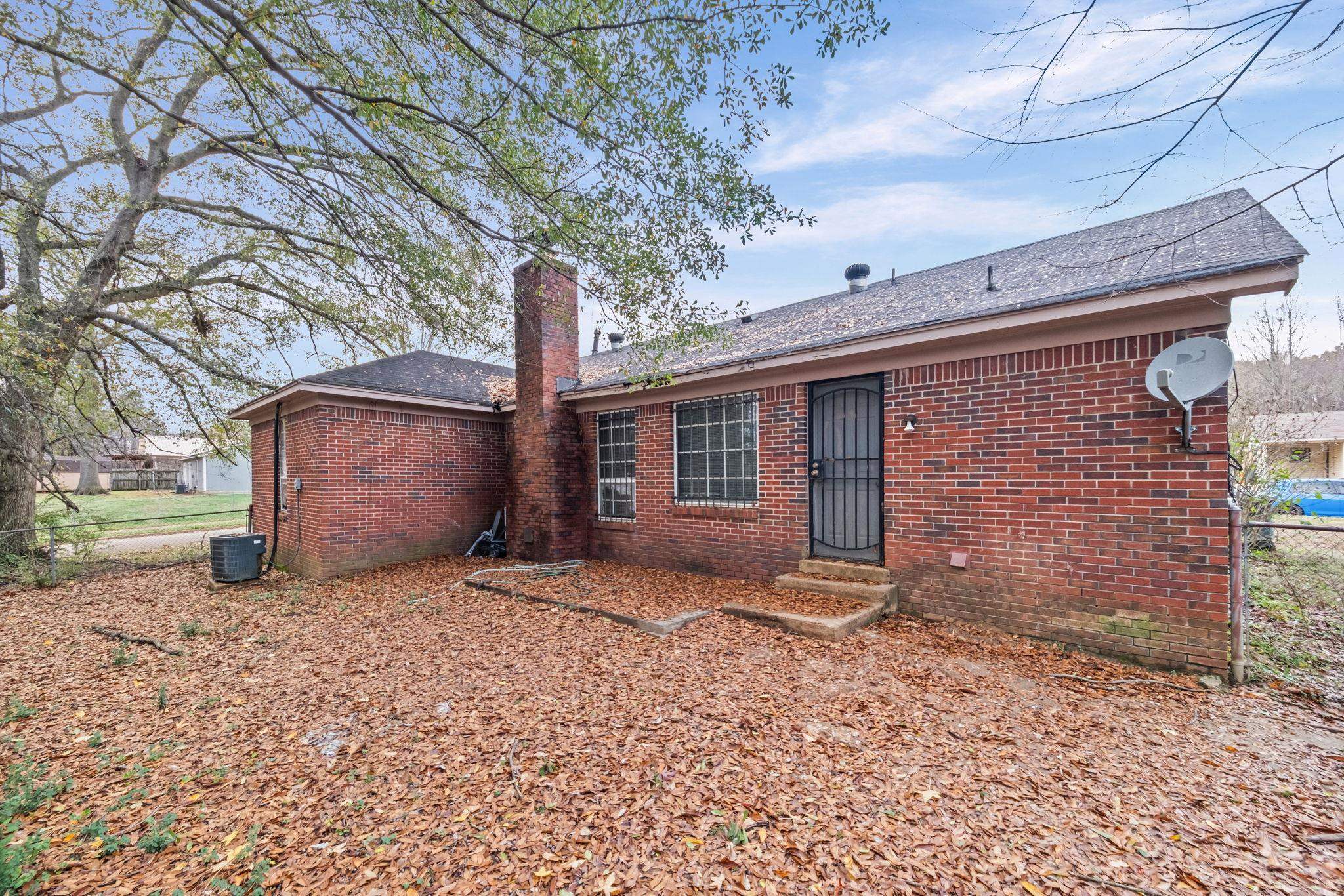 2967 Meadowfair Road Memphis, TN 38118 - Photo 19 of 19 a view of a house with a yard and tree