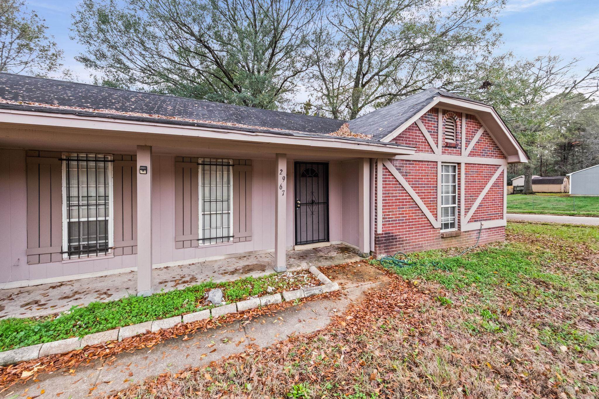 2967 Meadowfair Road Memphis, TN 38118 - Photo 3 of 19 a front view of a house with garden