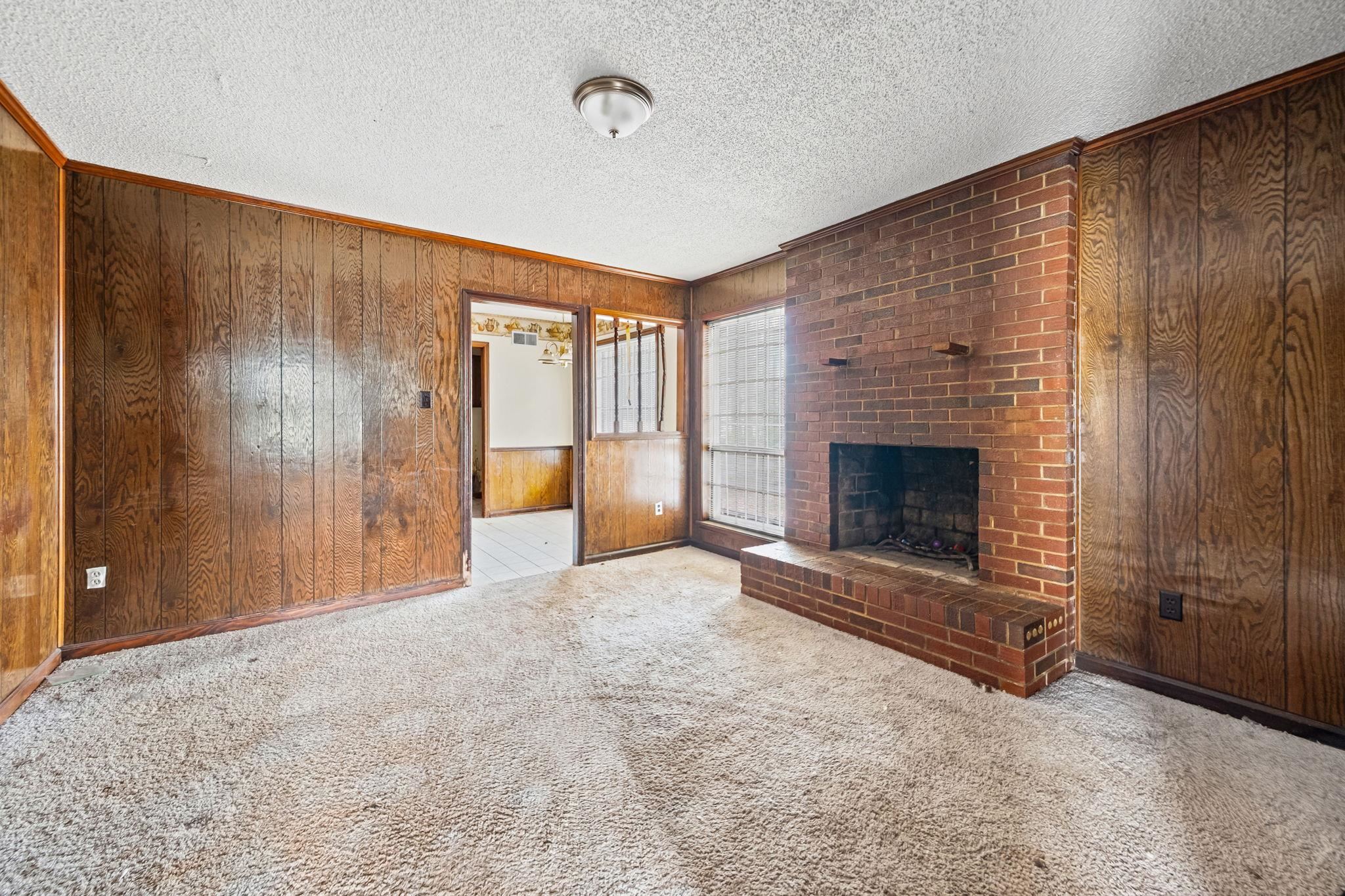 2967 Meadowfair Road Memphis, TN 38118 - Photo 8 of 19 a view of empty room with fireplace and windows