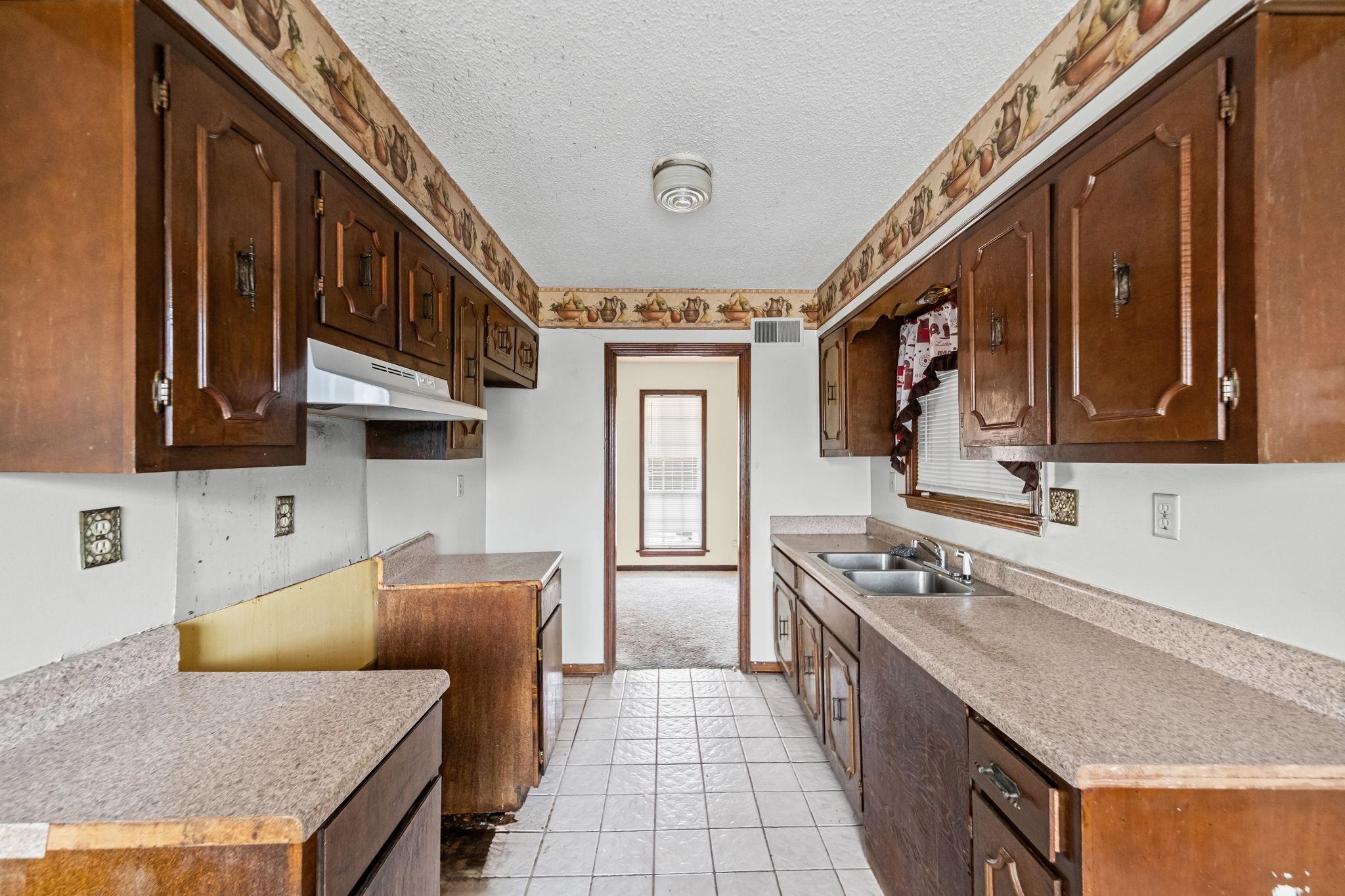 2967 Meadowfair Road Memphis, TN 38118 - Photo 10 of 19 a kitchen with stainless steel appliances granite countertop a stove and a sink