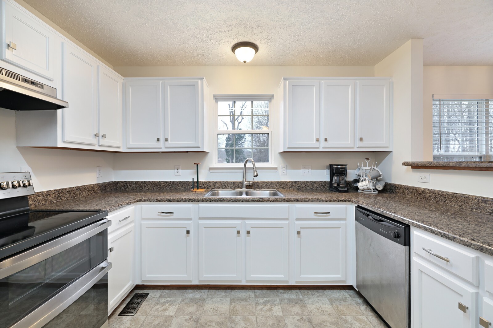 808 Jonathan Drive Lebanon, TN 37087 - Photo 11 of 29 a kitchen with granite countertop white cabinets and white appliances