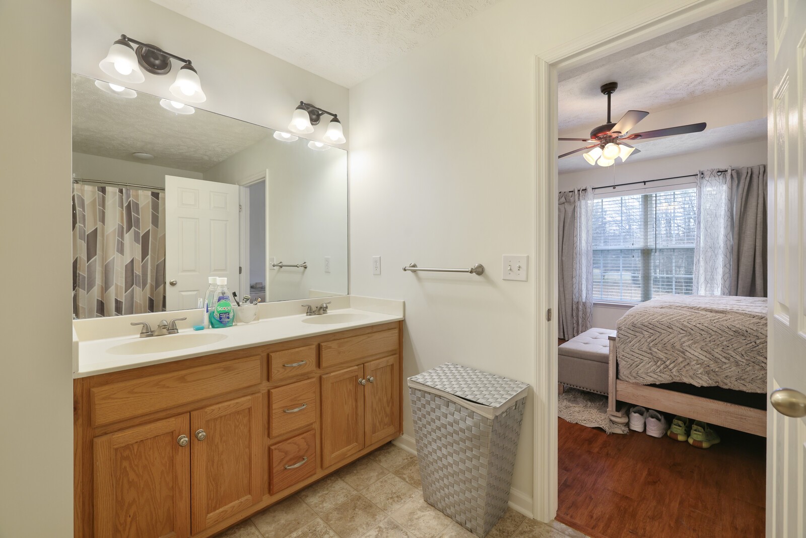 808 Jonathan Drive Lebanon, TN 37087 - Photo 16 of 29 a en suite bathroom with a double vanity sink a mirror and a shower