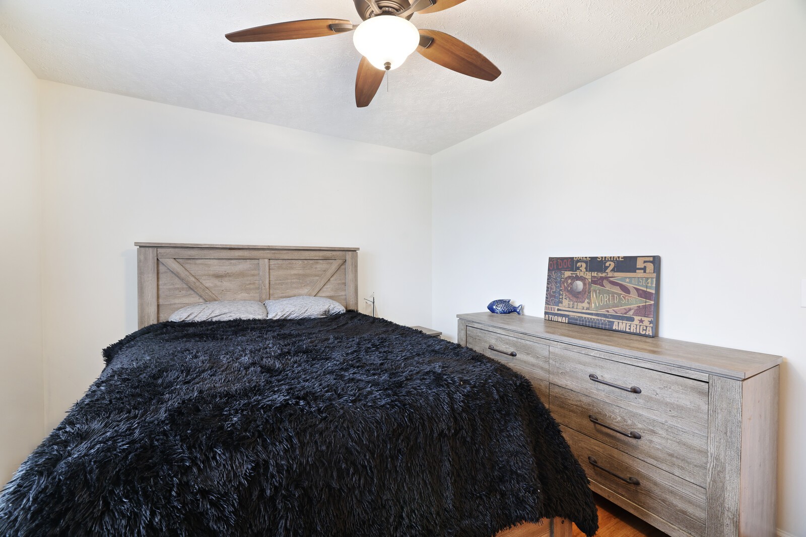 808 Jonathan Drive Lebanon, TN 37087 - Photo 21 of 29 a bedroom with a bed and a chandelier