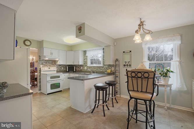 2177 Ambleside Court Frederick, MD 21702 - Photo 18 of 55 Brkfst nook/ remodeled kitch looks out on Koi pond