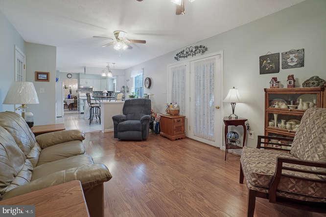 2177 Ambleside Court Frederick, MD 21702 - Photo 20 of 55 Den to kitchen sunroom on right