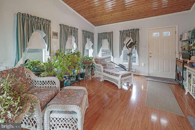 2177 Ambleside Court Frederick, MD 21702 - Photo 25 of 55 sunroom towards patio w/ hot tub